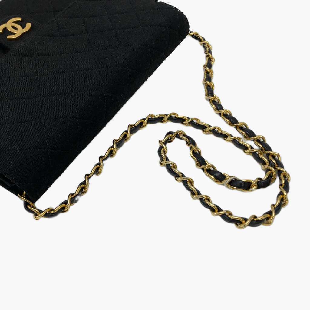 Chanel Jersey med en gylden og læder skulderrem