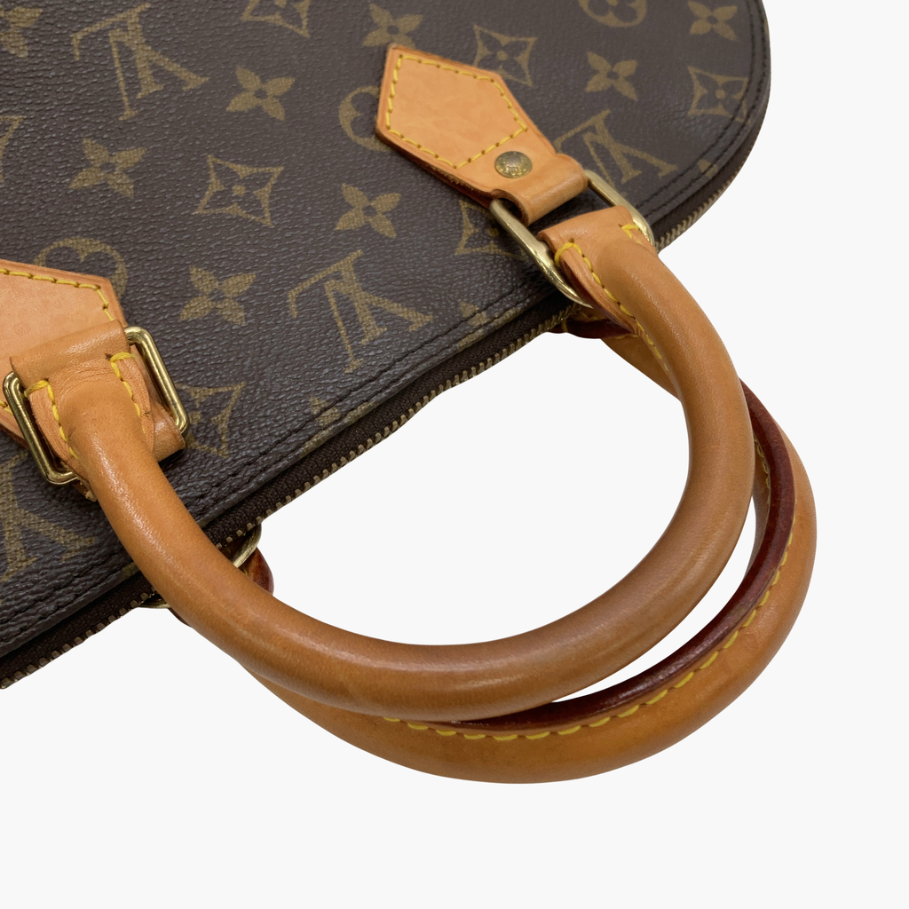 En kort lysebrun rem fra Louis Vuitton Alma