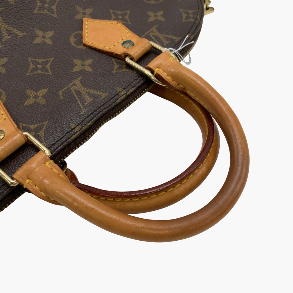 Louis Vuitton Alma - låsen og den lysebrune læderrem